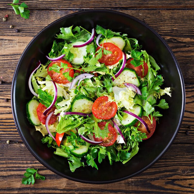 salad-from-tomatoes-cucumber-red-onions-and-lettuce-leaves-healthy-summer-vitamin-menu-vegan-vegetable-food-vegetarian-dinner-table-top-view-flat-lay